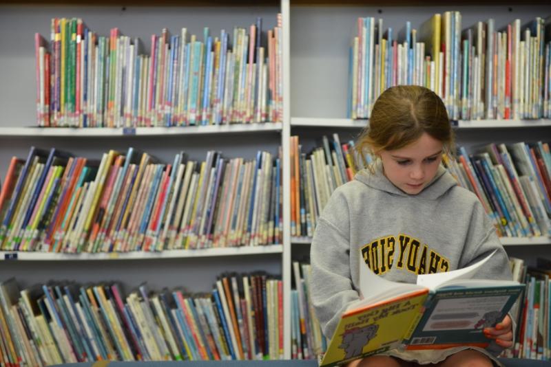Elementary School Student Reading in Library at Shady Side Academy in Pittsburgh
